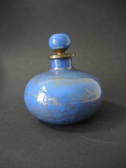 Blaue Flasche mit Stöpsel und Goldmalerei