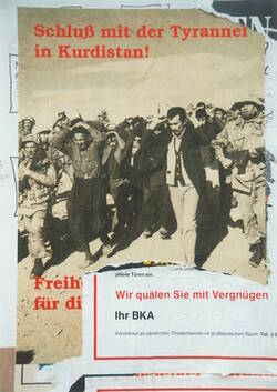 mehrfach überklebte Plakate mit Aufruf "Schluß mit den Tyrannen in Kurdistan" und Werbung für BKA
