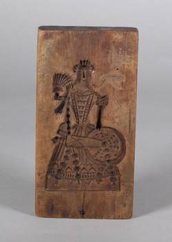 Zweiseitiger Holzmodel mit den Darstellungen eines Reiters und einer Frau am Spinnrad