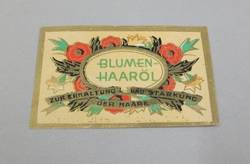 Etikett für Blumen-Haaröl eines unbekannten Herstellers;