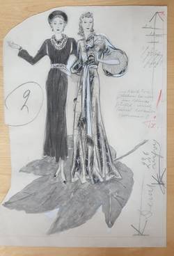 Modezeichnung: Zwei Figurinen in Abendkleidern. auf einem Ahornblatt stehend