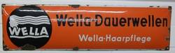 Schild mit "Wella"-Werbung