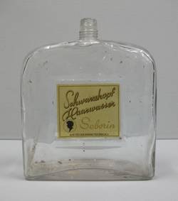 Große Flasche mit Haarwasser "Seborin" der Firma Schwarzkopf