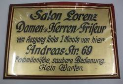 Schild des Salon Lorenz;